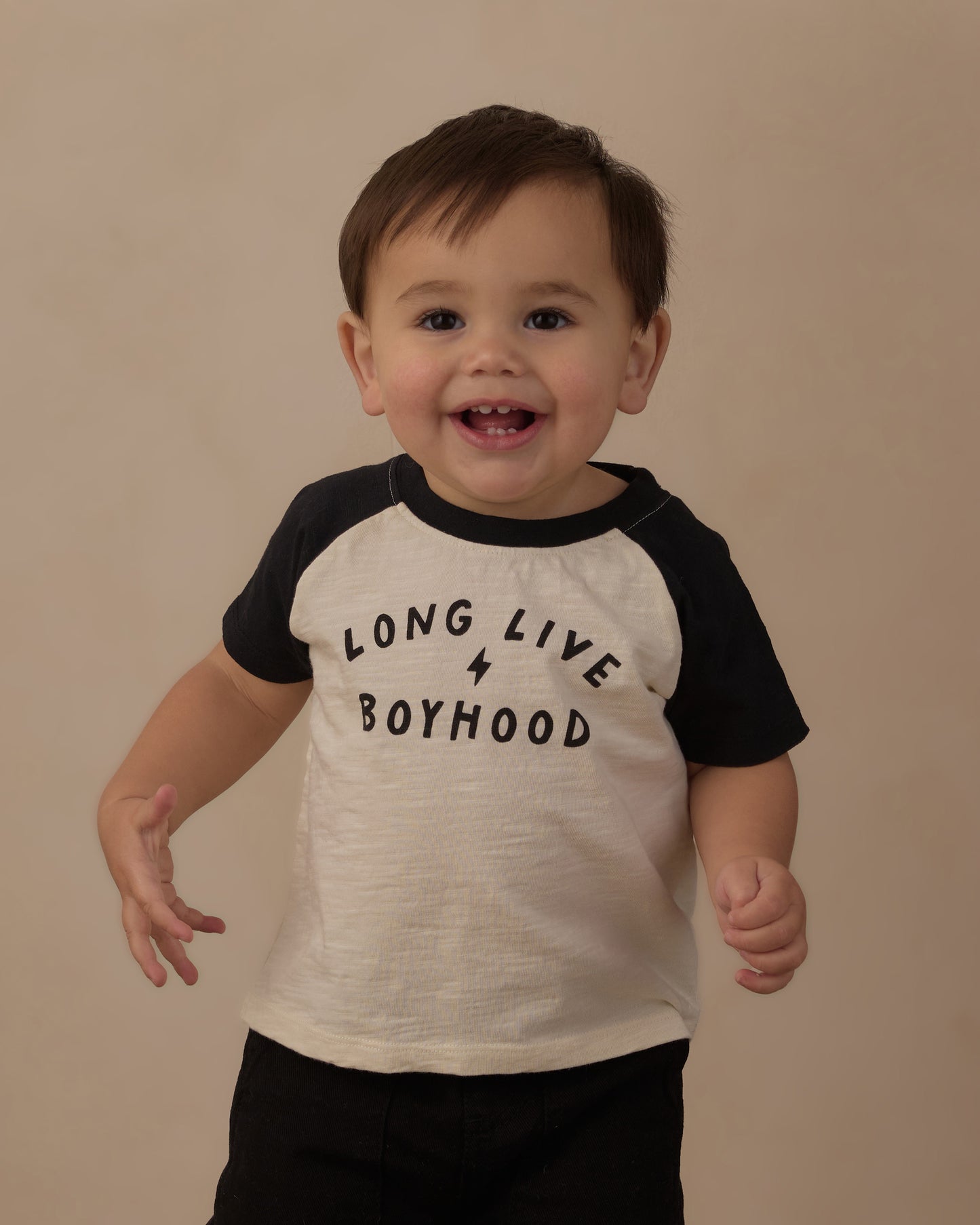 Baby in the Rylee + Cru Long Live Boyhood raglan tee, cream body with black sleeves