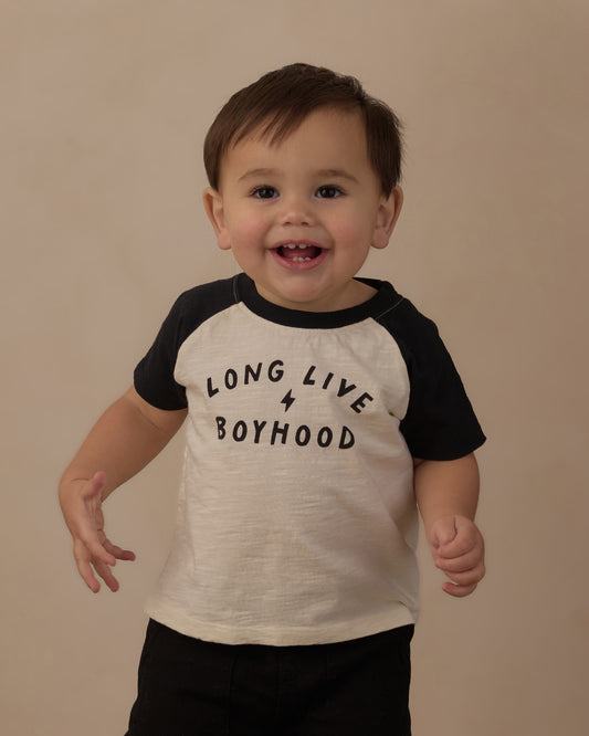 Baby in the Rylee + Cru Long Live Boyhood raglan tee, cream body with black sleeves