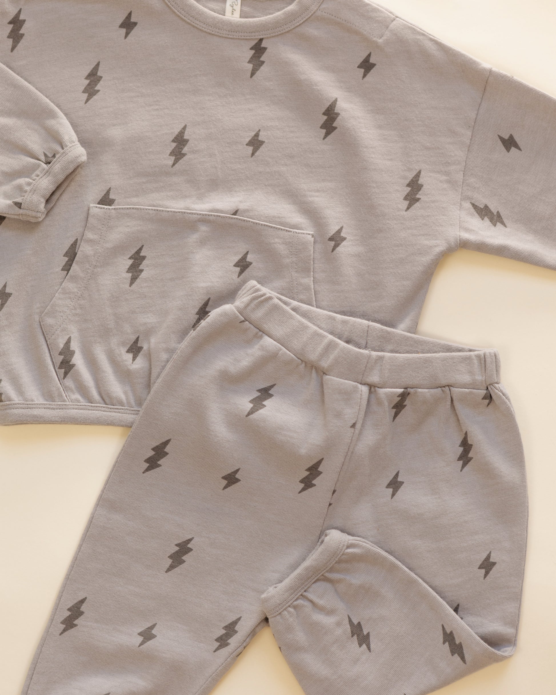 Closer styled flat of the Rylee + Cru Bolts relaxed set showing the lightning bolt print