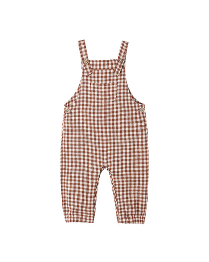 Rylee + Cru Baby Overalls in brick check gingham, laid flat with adjustable straps