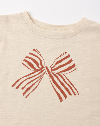 Close view of the red and white striped bow print on the Rylee + Cru ruffle long sleeve tee