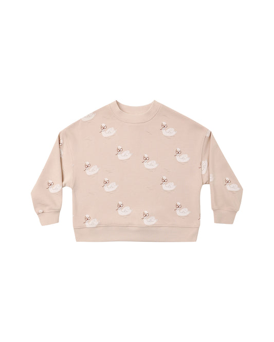 Rylee + Cru boxy pullover in blush with an allover swan print, flat lay front view