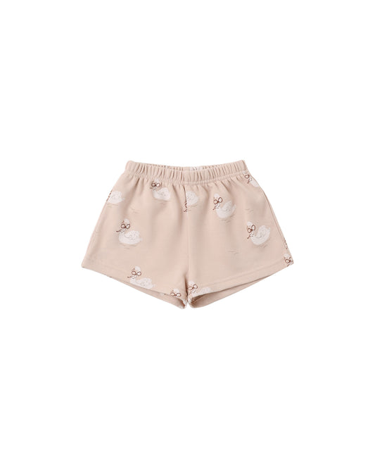 Rylee + Cru track short in blush with a swan print, flat lay front view