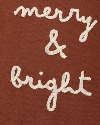 Close view of the embroidered merry & bright script on the Rylee + Cru relaxed sweatshirt