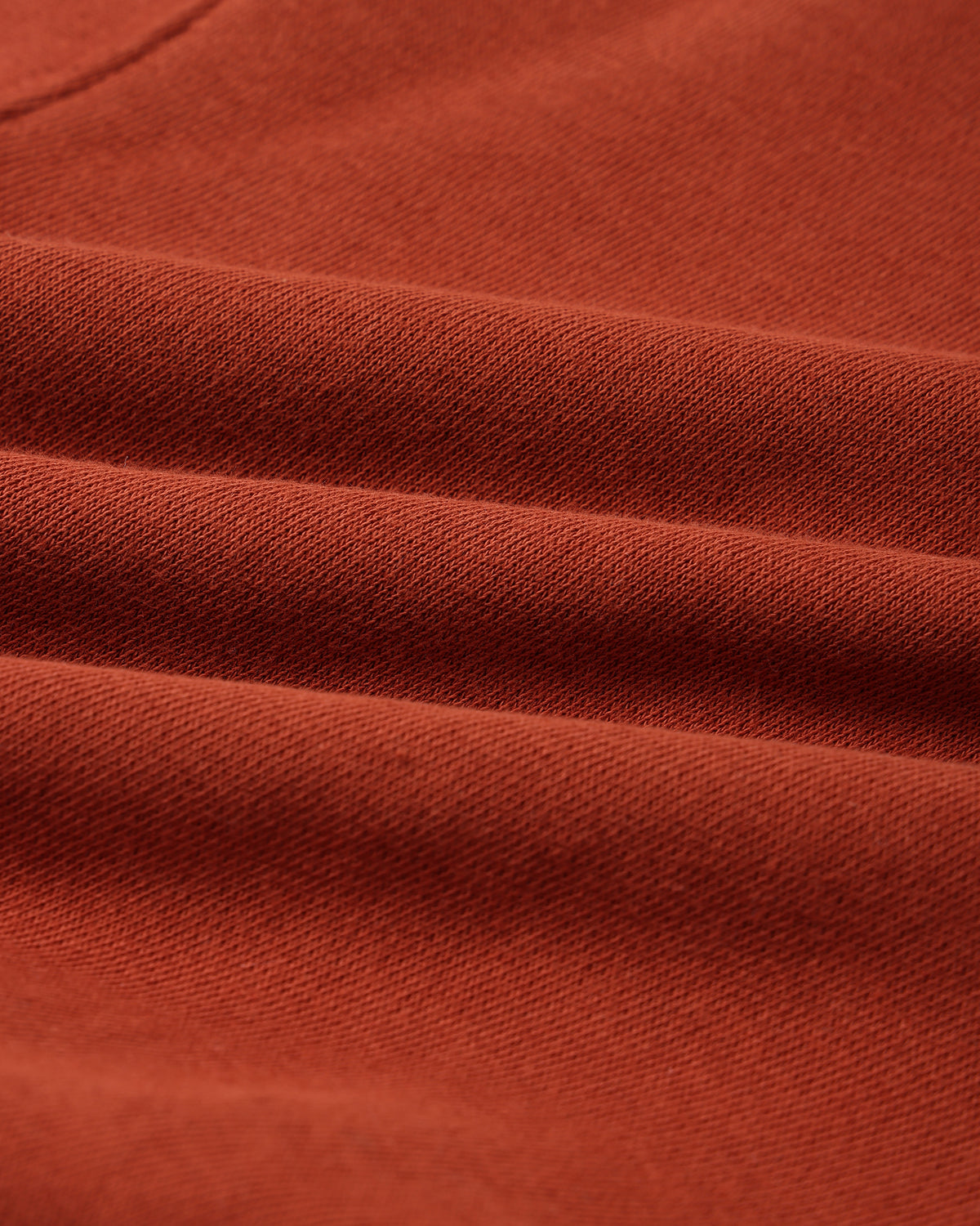 Fabric detail of the rust red cotton fleece on the Rylee + Cru Merry & Bright relaxed sweatshirt
