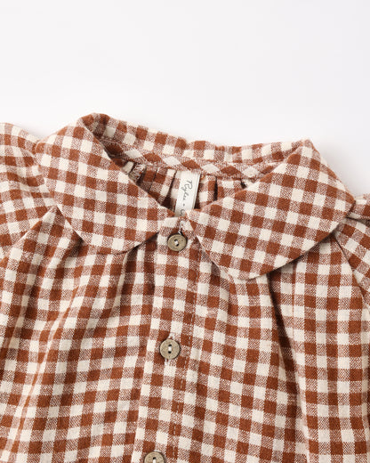 Close view of the Peter Pan collar and brick check fabric on the Nellie set top