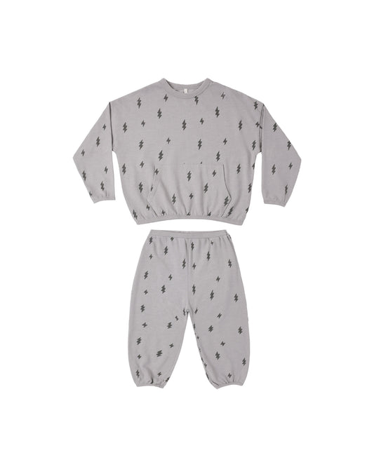 Rylee + Cru Relaxed Set in Bolts laid flat, sweatshirt and pants in dusty blue with lightning bolts