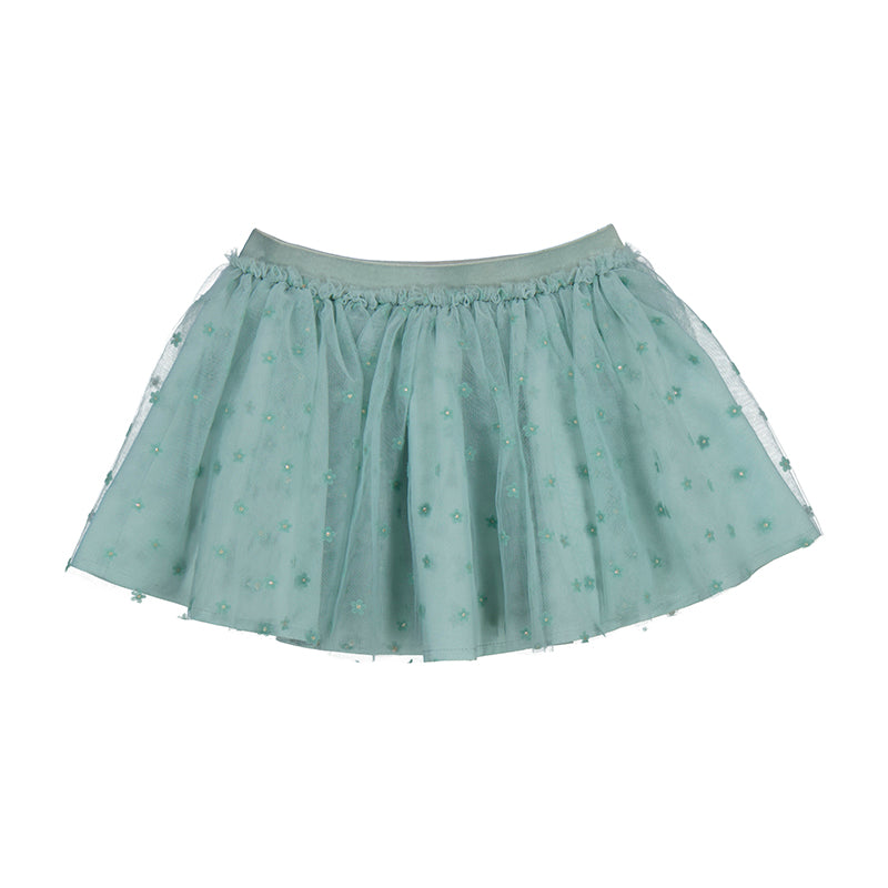 Green skirt with white accents on a white background