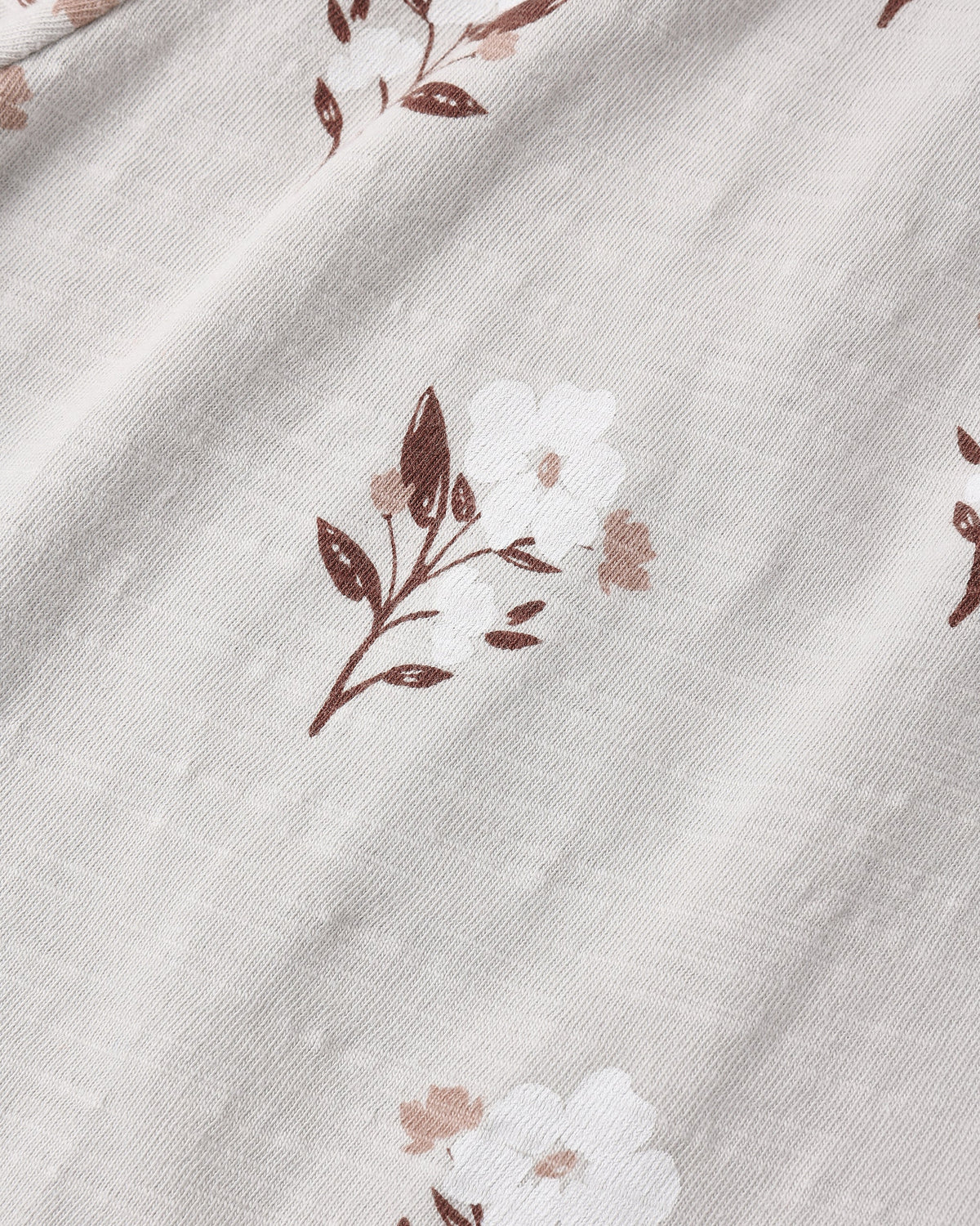 Close view of the Wildflower print fabric, small brown and cream flowers on a soft ground