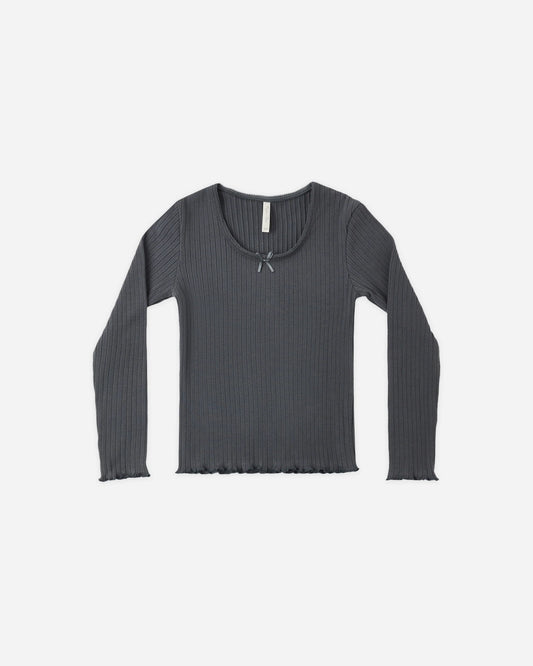 Rylee + Cru ribbed long sleeve top in midnight with a lettuce hem and bow detail, flat lay front view
