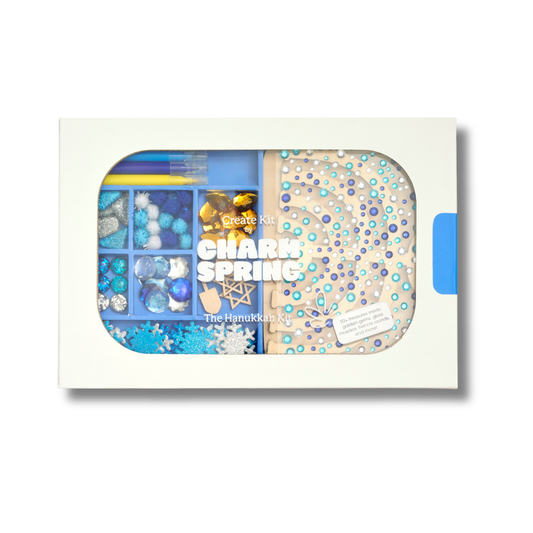 Charmspring Create Kit Hanukkah with a clear window showing compartments of blue, silver and white beads and charms