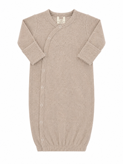 Tan speckle knotted baby gown laid flat