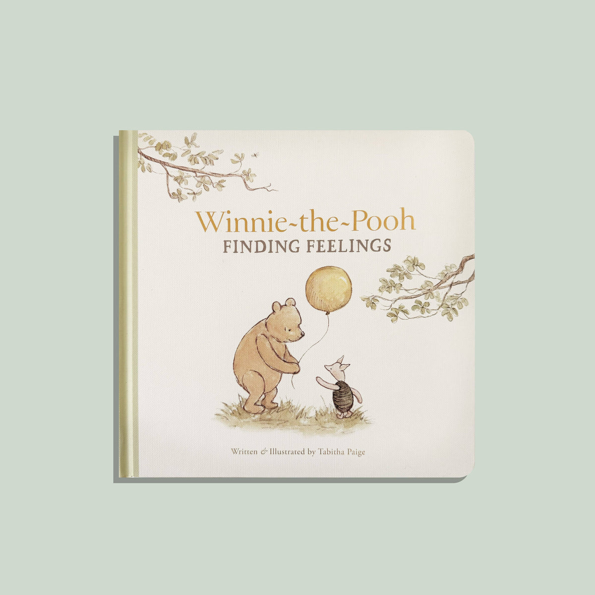 Winnie-the-Pooh: Finding Feelings board book cover, Pooh and Piglet with a yellow balloon in watercolor