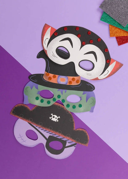 Colorful paper masks on a purple background
