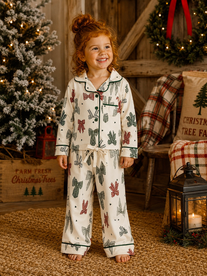 Girl wearing the SpearmintLOVE Country Christmas Bows lounge set in a cozy holiday living room