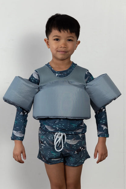 Boy wearing Stone Blue Water Wing Floaties
