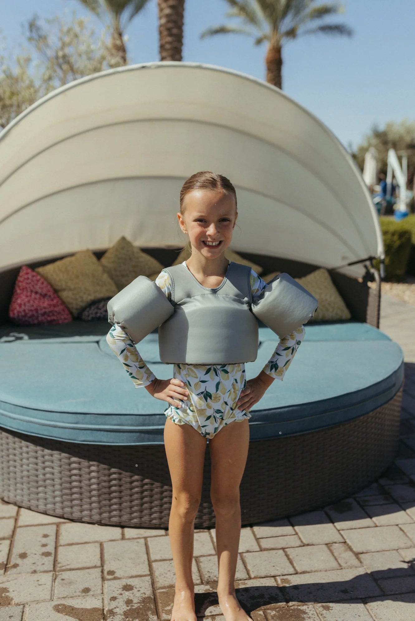 Girl wearing Stone Blue Water Wing Floaties