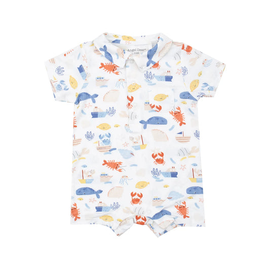 Baby romper with sea-themed print on a white background