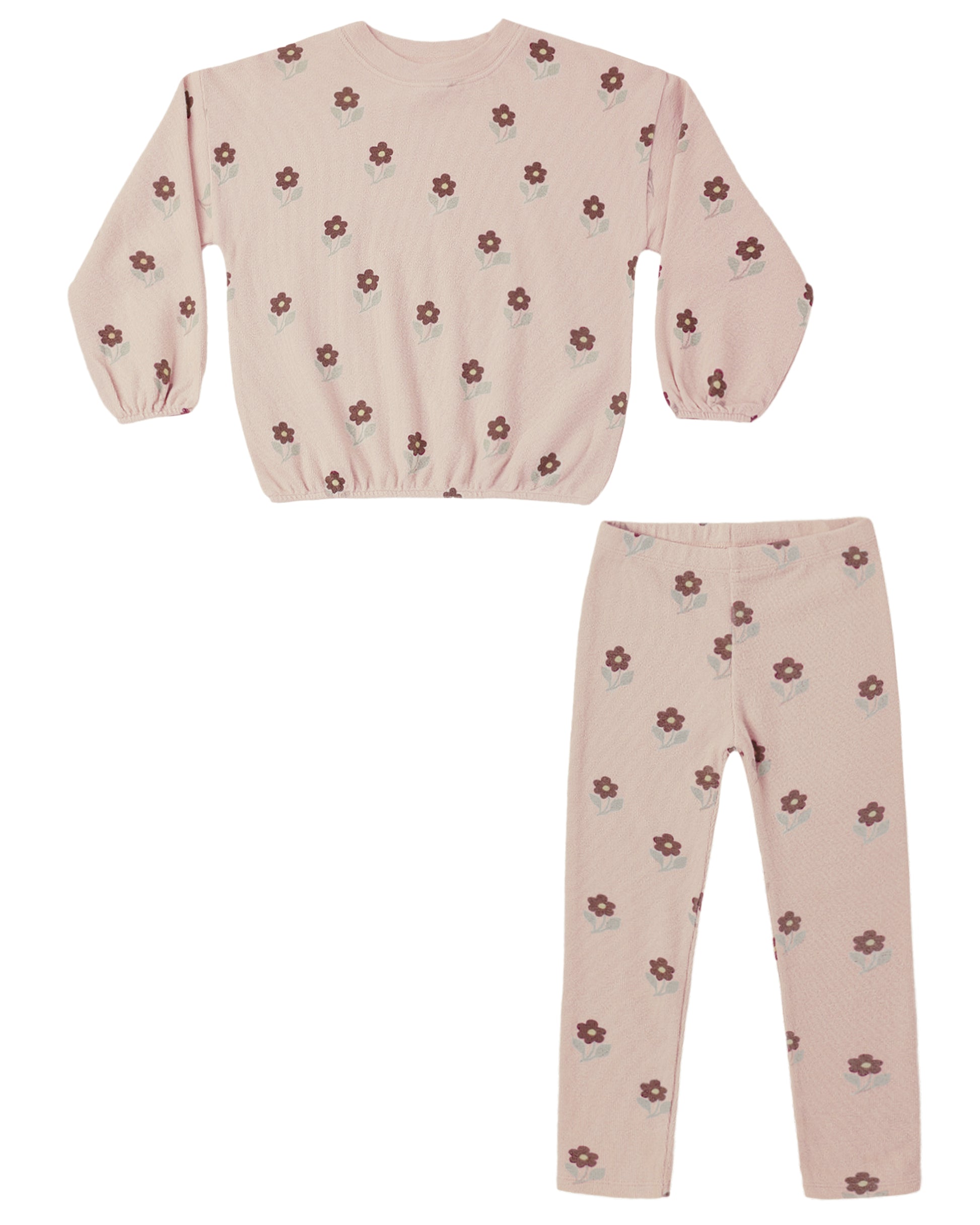 Children's pink outfit with floral pattern on a white background
